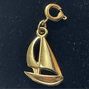 Vintage Diamonds International gold toned sailboat charm.
